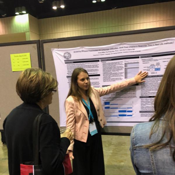 Anna Miller presenting her research at ASHA 2019
