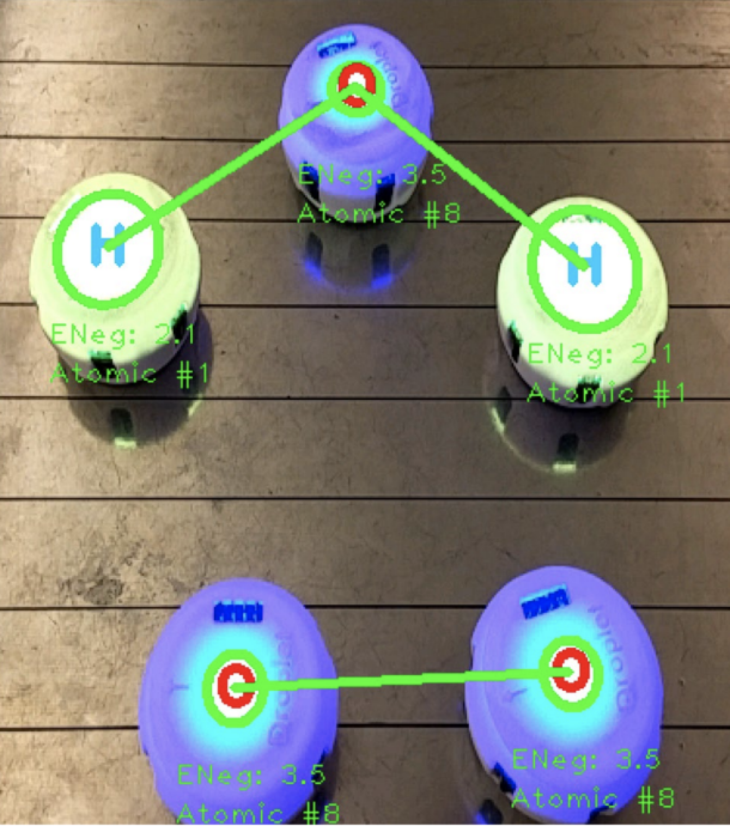 Atoms assembled into a chemical molecule using augmented reality to show bonds.