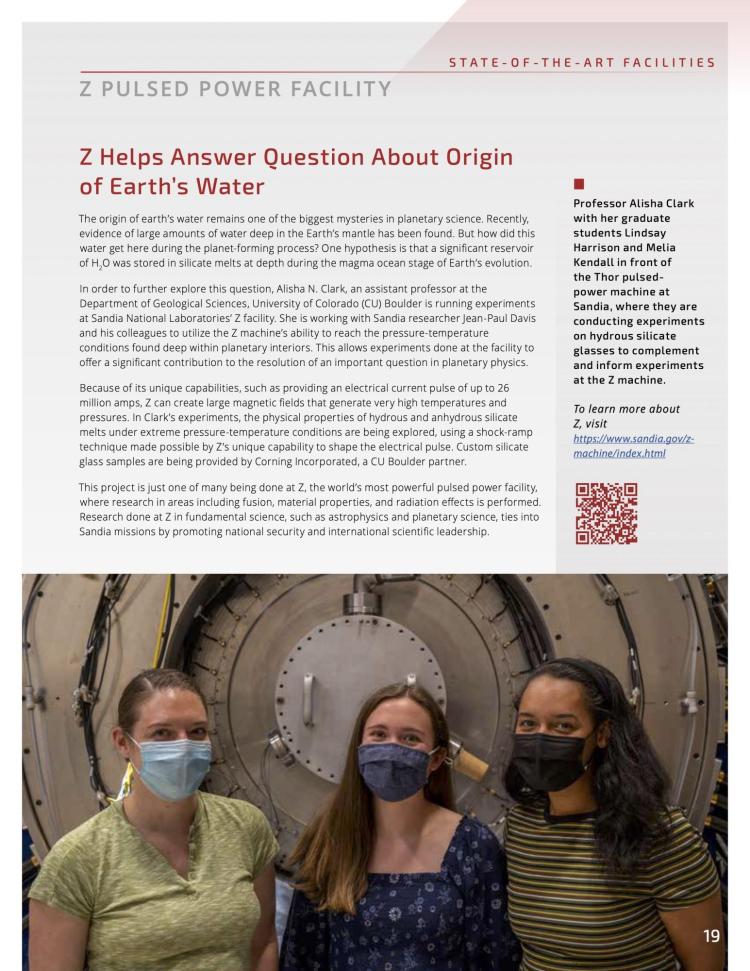 Image of page 19 from the 2021 Sandia Partnerships Annual Report. The top half of the page contains a short article about the work done at Sandia National Laboratories’ Z facility by Alisha Clark and her graduate students, Lindsay Harrison and Melia Kendall. A photo fills the bottom half of the page, and shows Alisha, Lindsay, and Melia standing together in front of the Thor pulsed-power machine at Sandia.