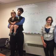 Orion with his family celebrating a successful defense