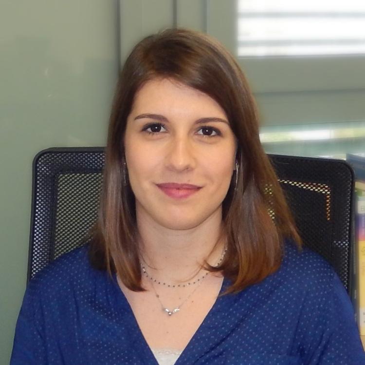 A professional headshot of Ana
