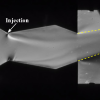 Schlieren photograph of the dual-throat nozzle at a pressure ratio of two with secondary injection from the top.
