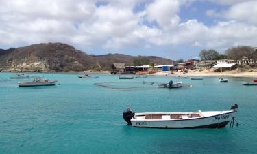 A small boat moored in a cove with turquoise water