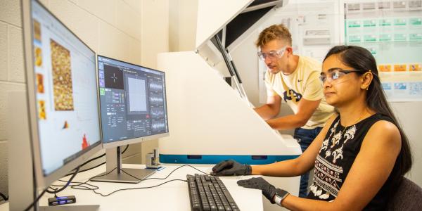 Neha Mahuli & Marcel Junige at the AFM; Atomic Force Microscope