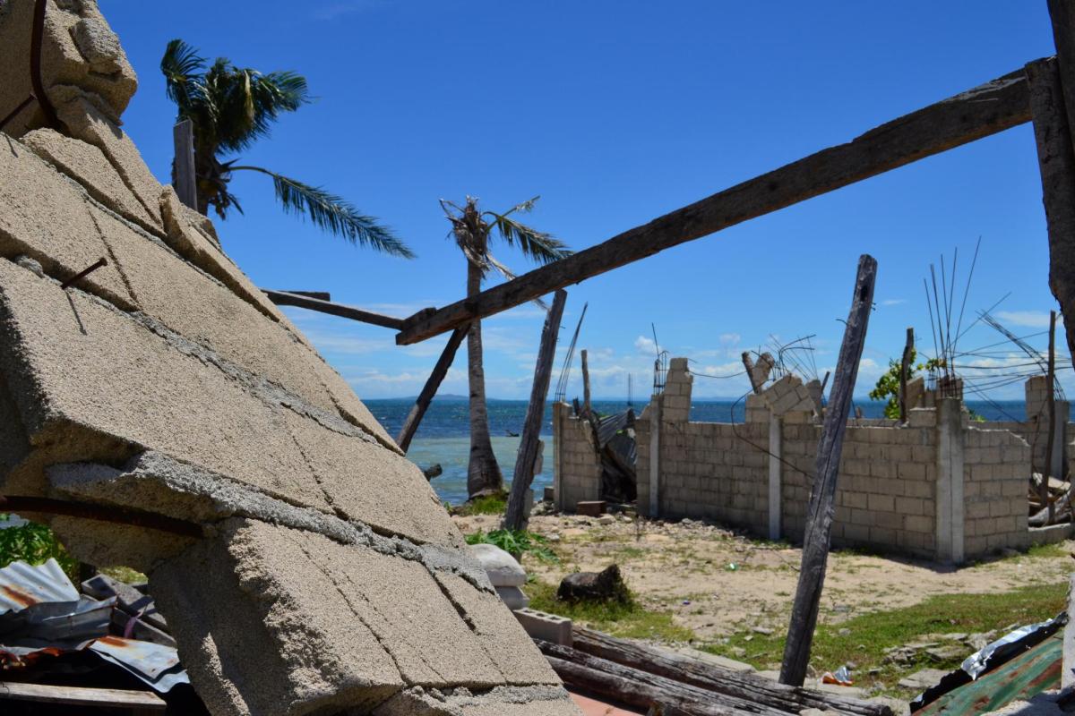 Damaged housing wall in aftermath of typhoon