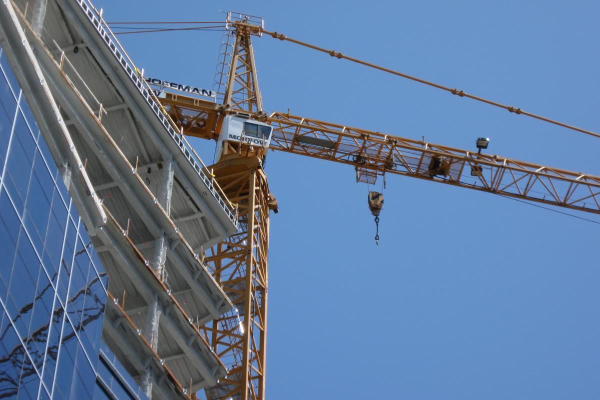 Tower crane over building under construction