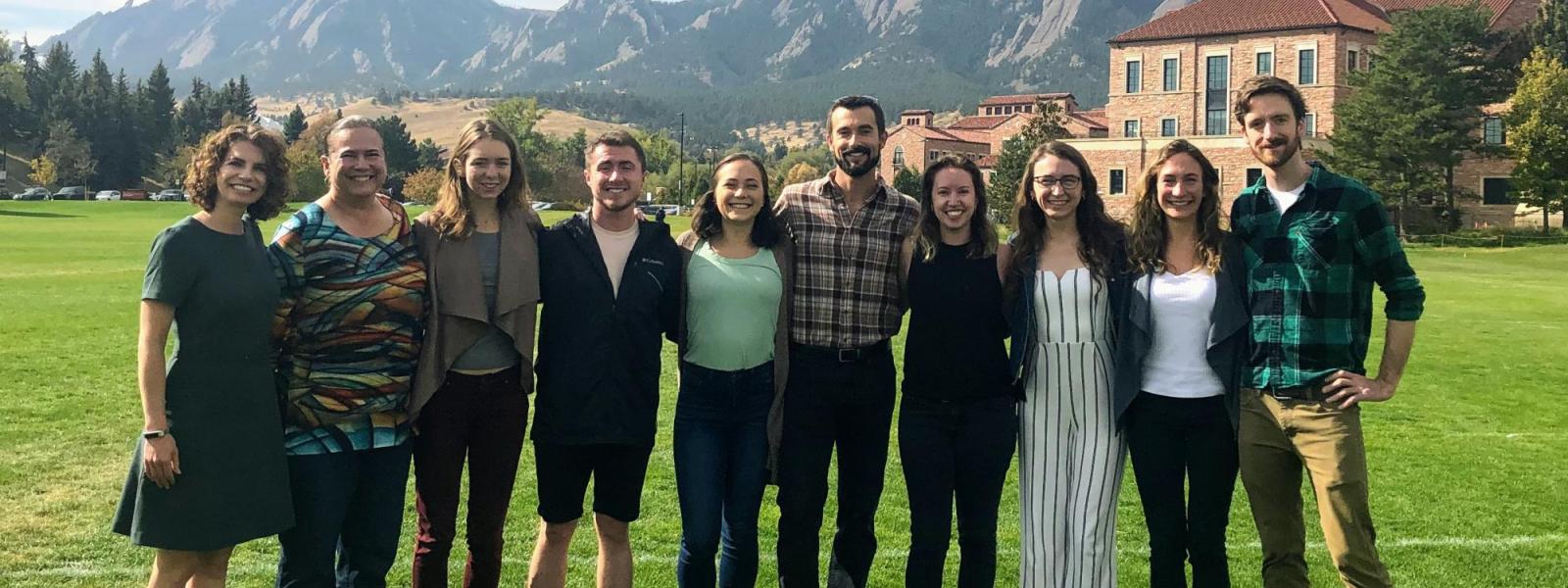 Global Projects and Organizations group in front of Flatirons at Business Field, November 2019