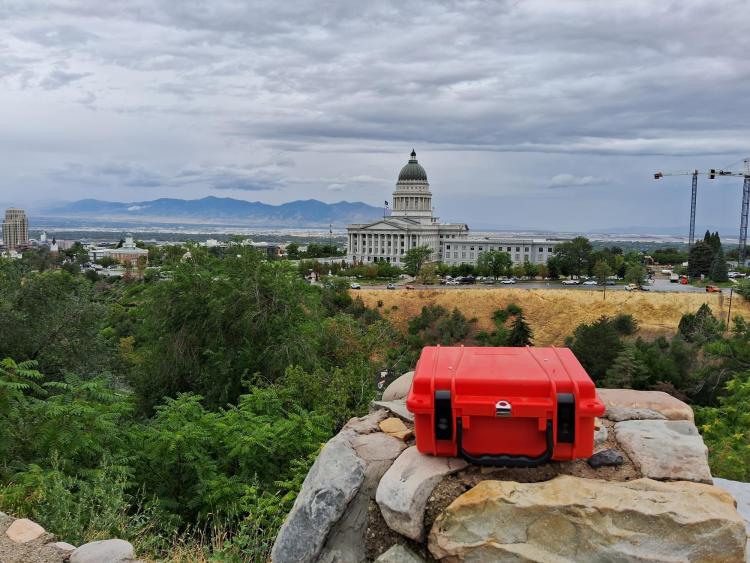 Air monitor by the state capitol building in SLC with the Oquirrh mountains in the background