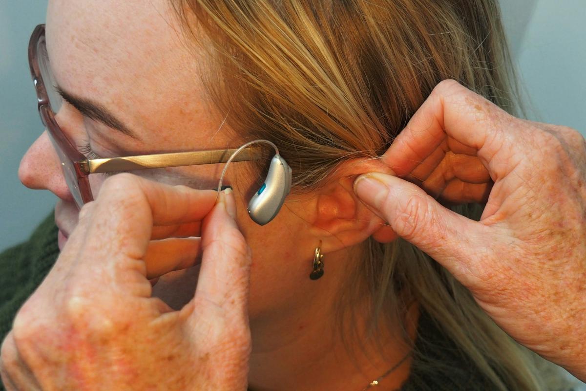 Woman being fit with hearing aid