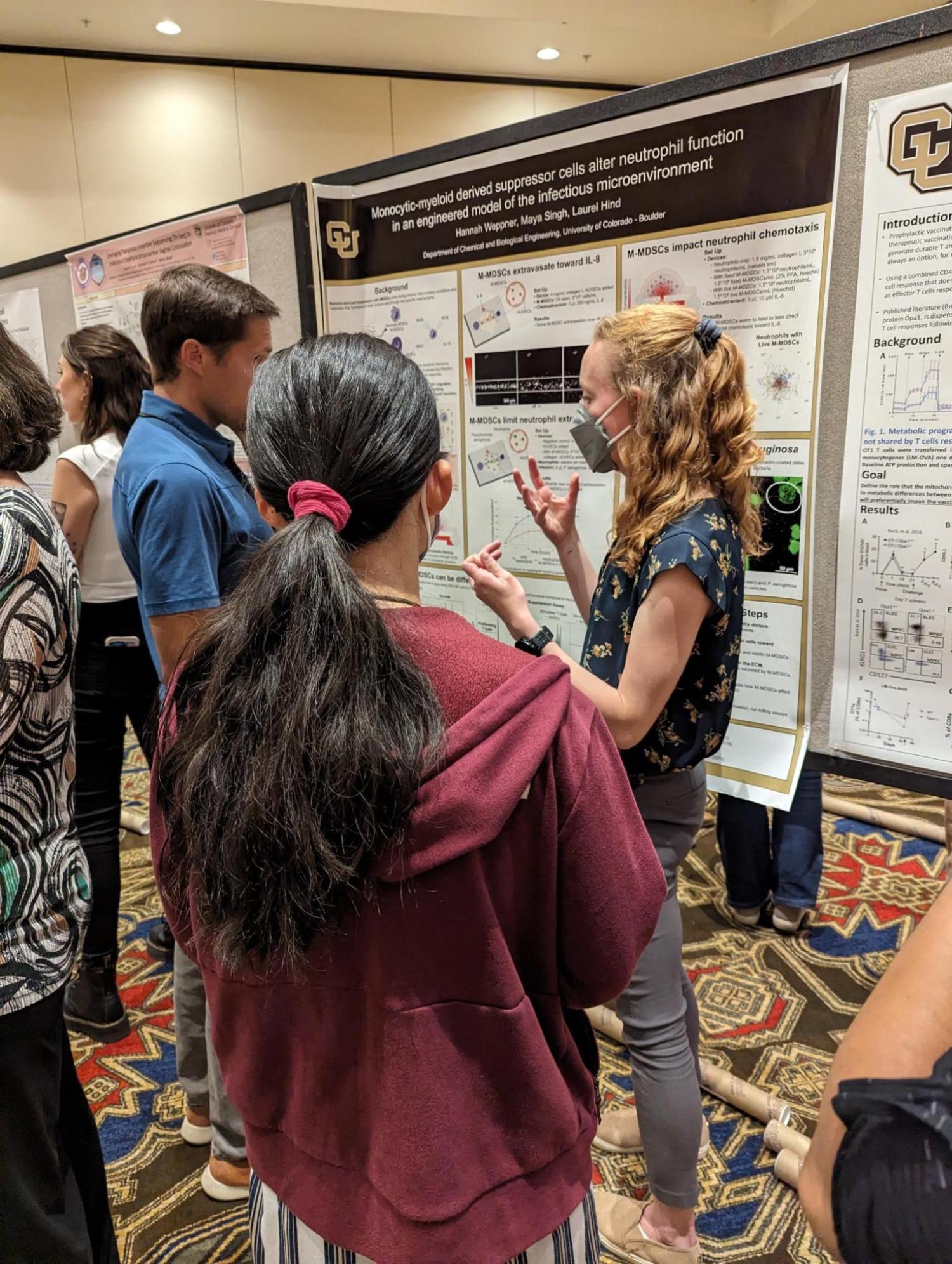 Hannah from the Hind lab presenting research poster