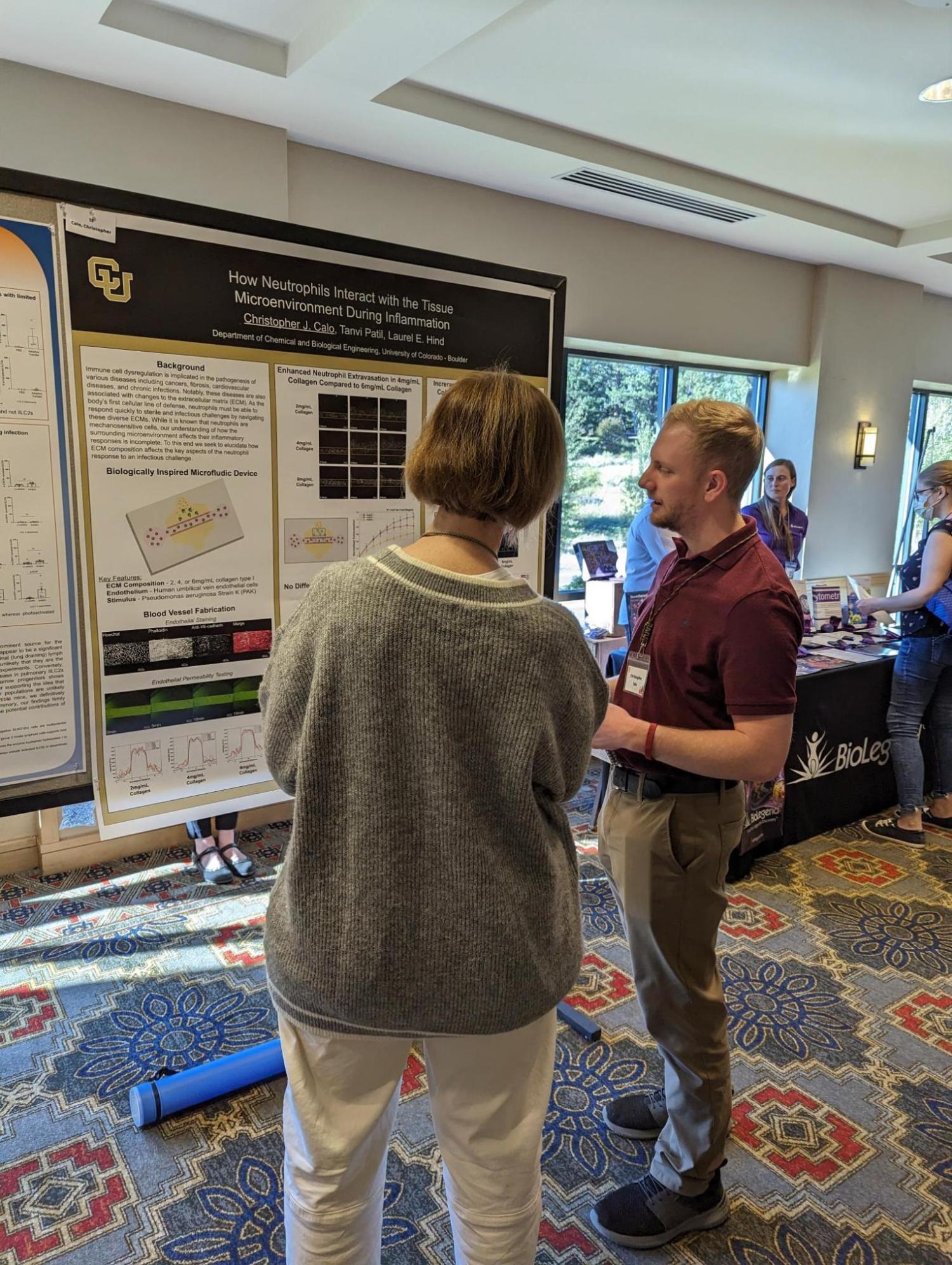 Chris from the Hind lab presenting research poster