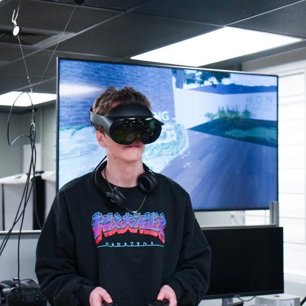 student using VR headset in lab