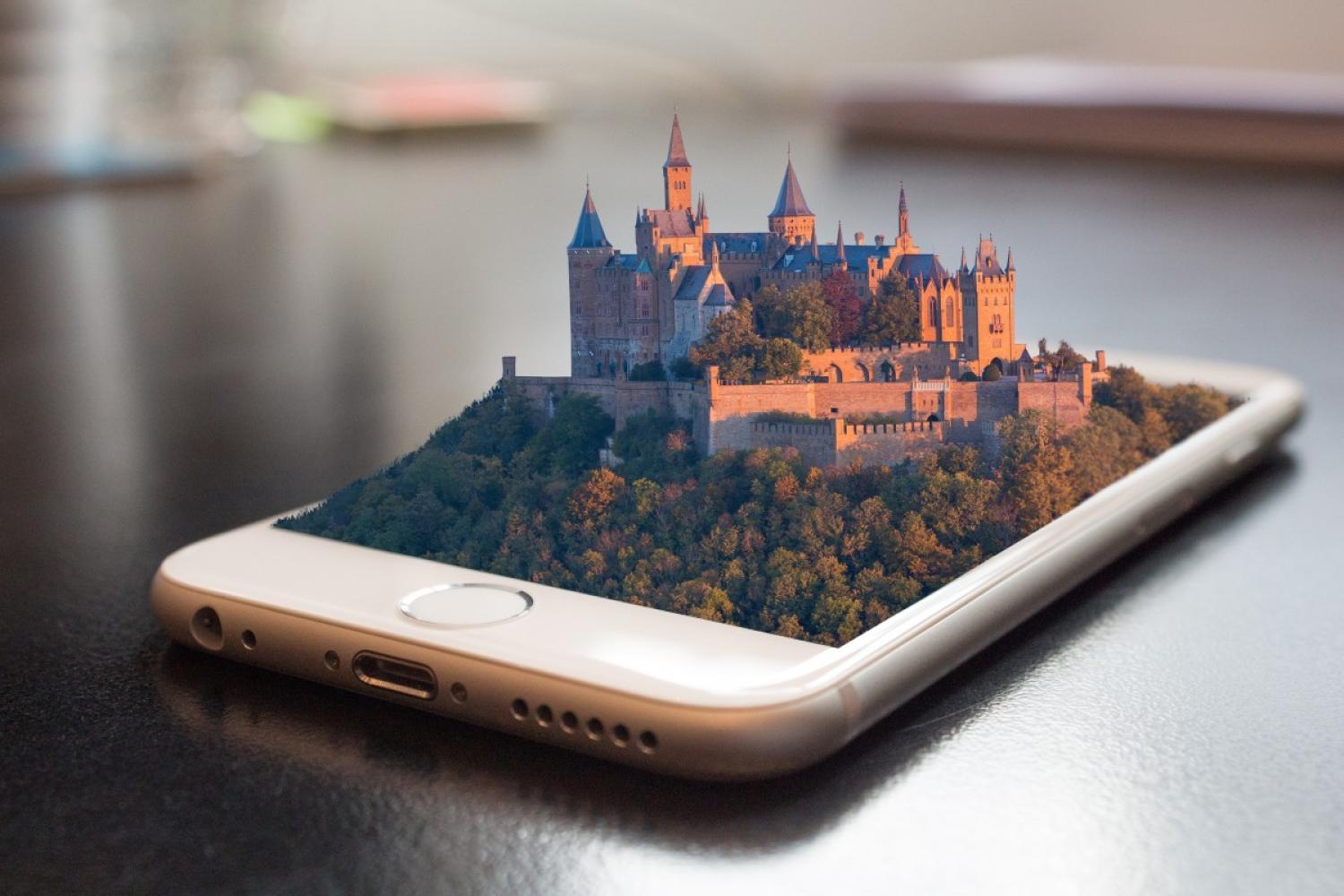 Castle emerging from a smartphone screen, via https://pxhere.com/en/photo/1168447.