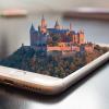 Castle emerging from a smartphone screen, via https://pxhere.com/en/photo/1168447.
