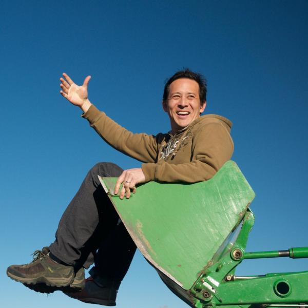 Jason hanging in the tractor bucket