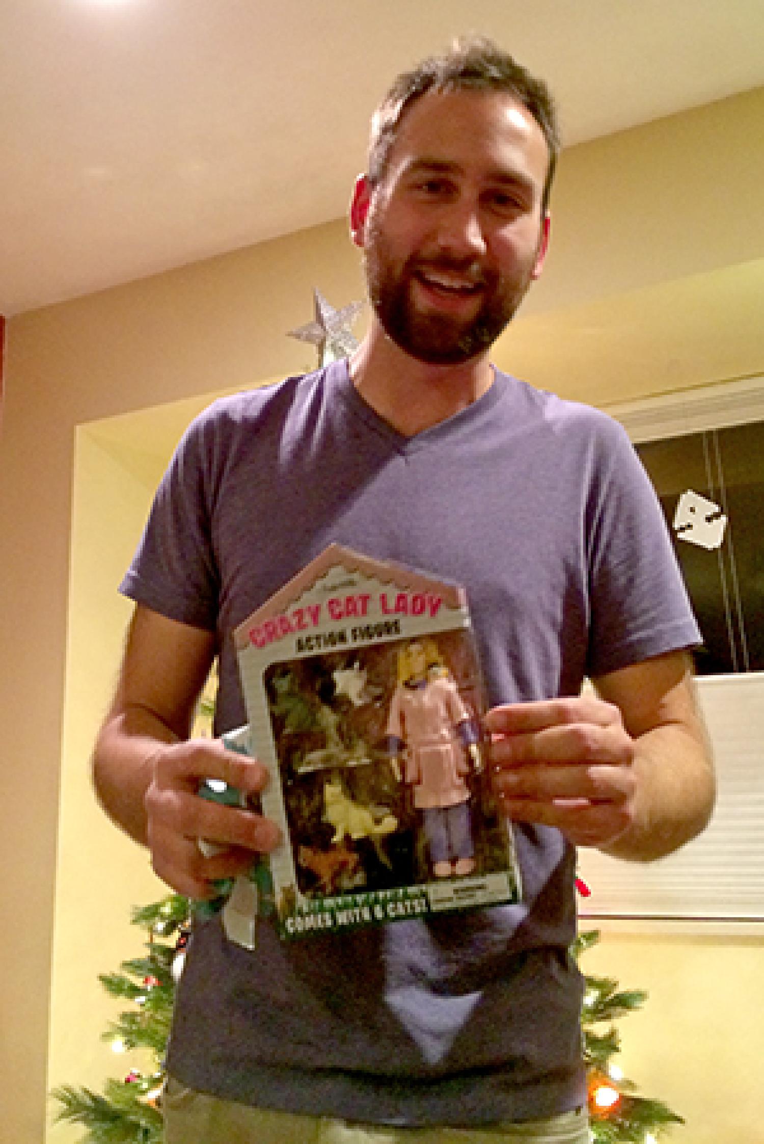 Kyle with his Crazy Cat Lady white elephant gift.