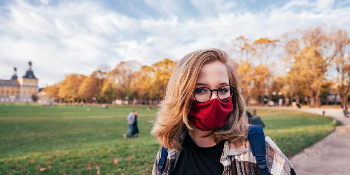 Girl wearing a face mask on campus