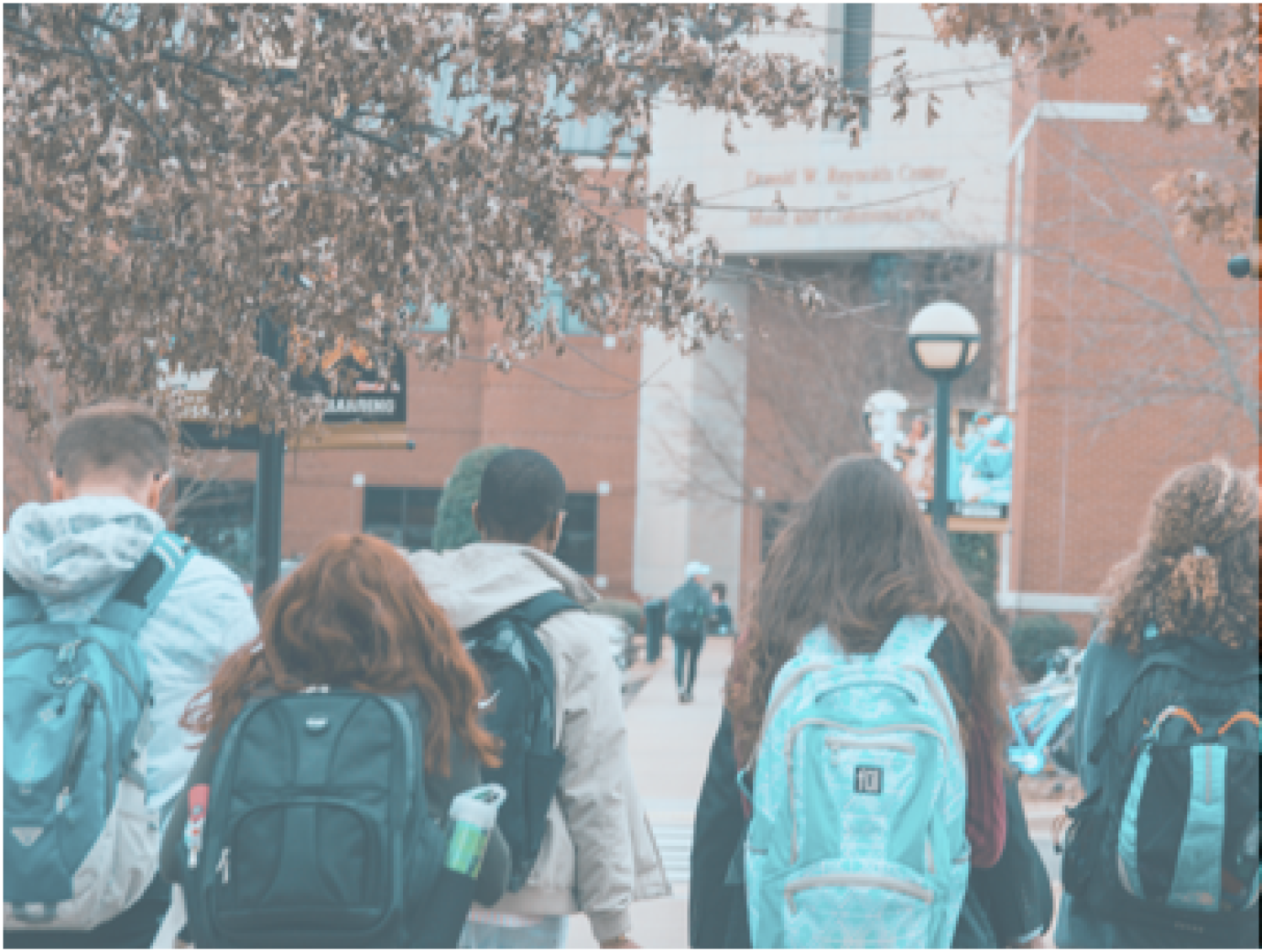Students with backpacks walking
