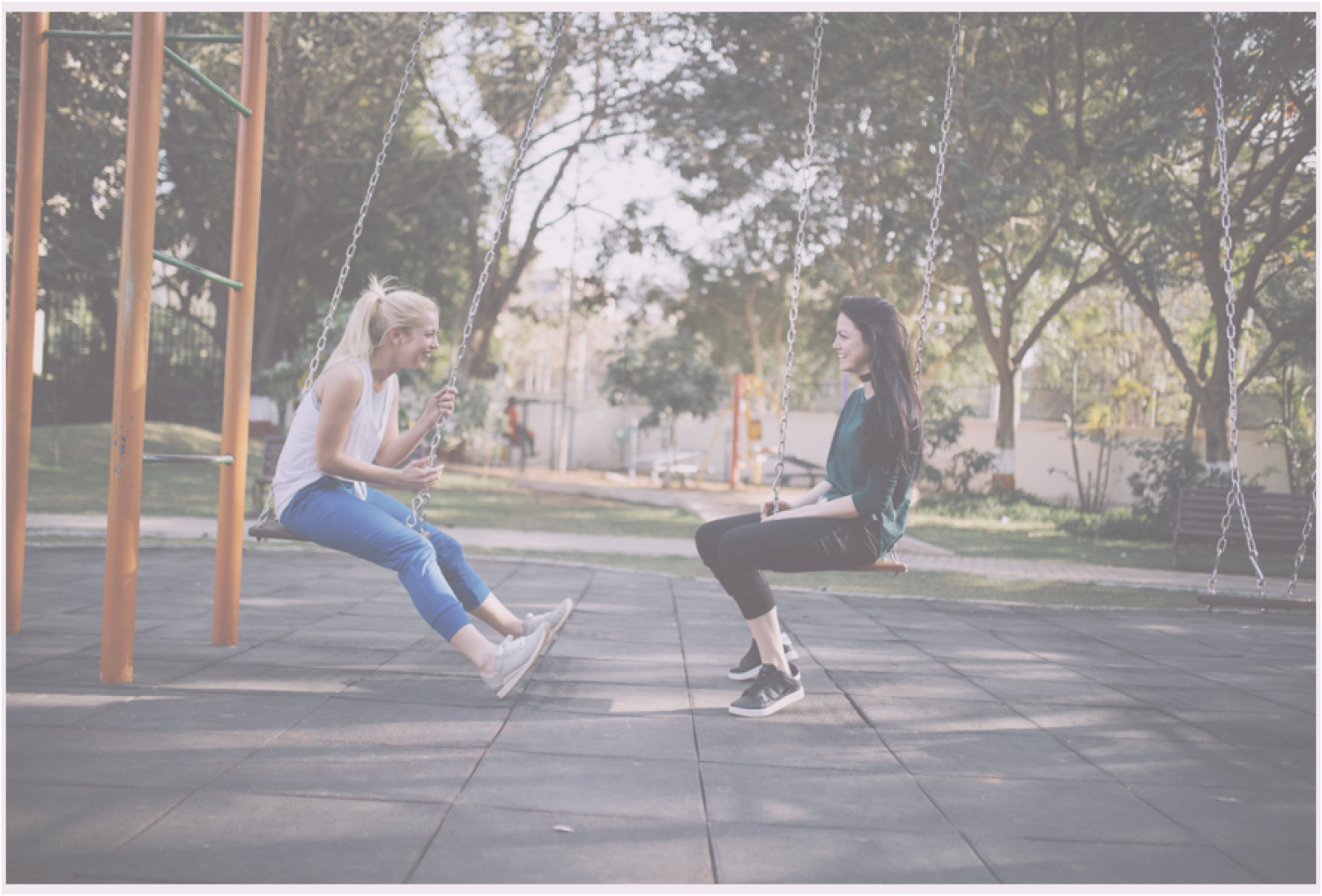 two girls on swings
