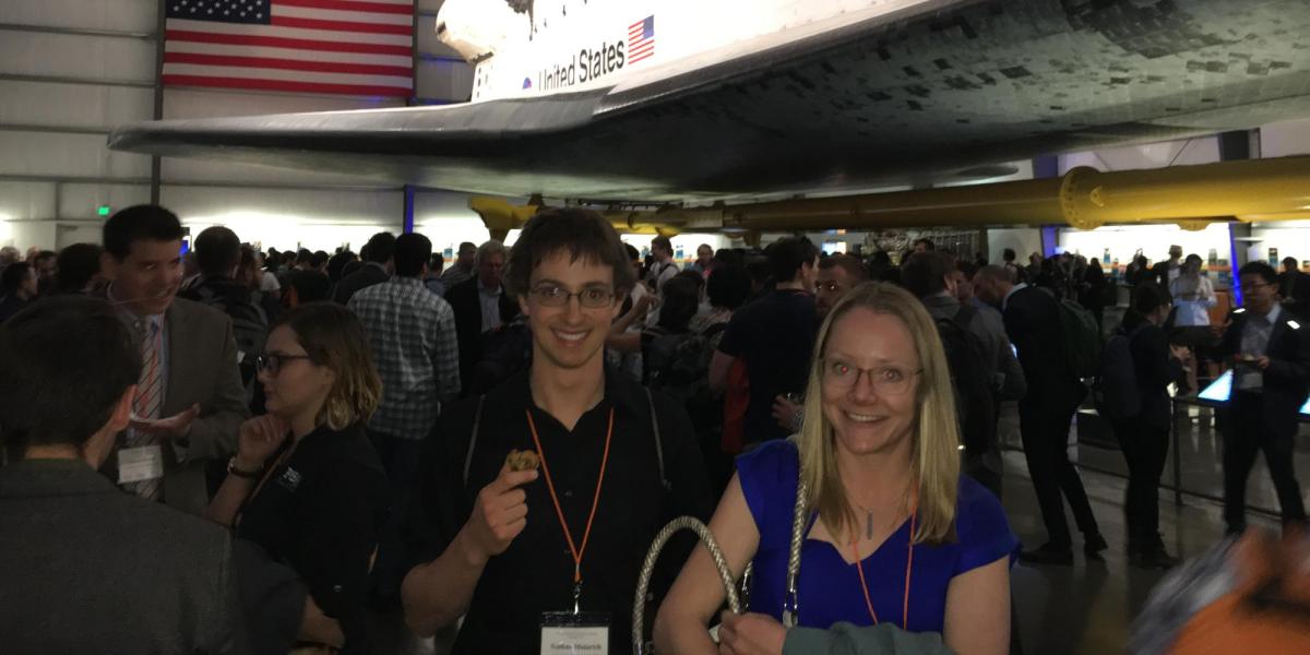 Amanda and Nate in front of a NASA space shuttle