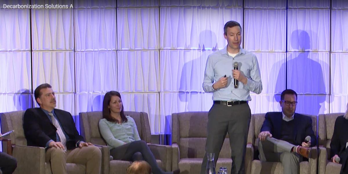 Greg Rieker giving a talk as a panel at the 21st energy symposium