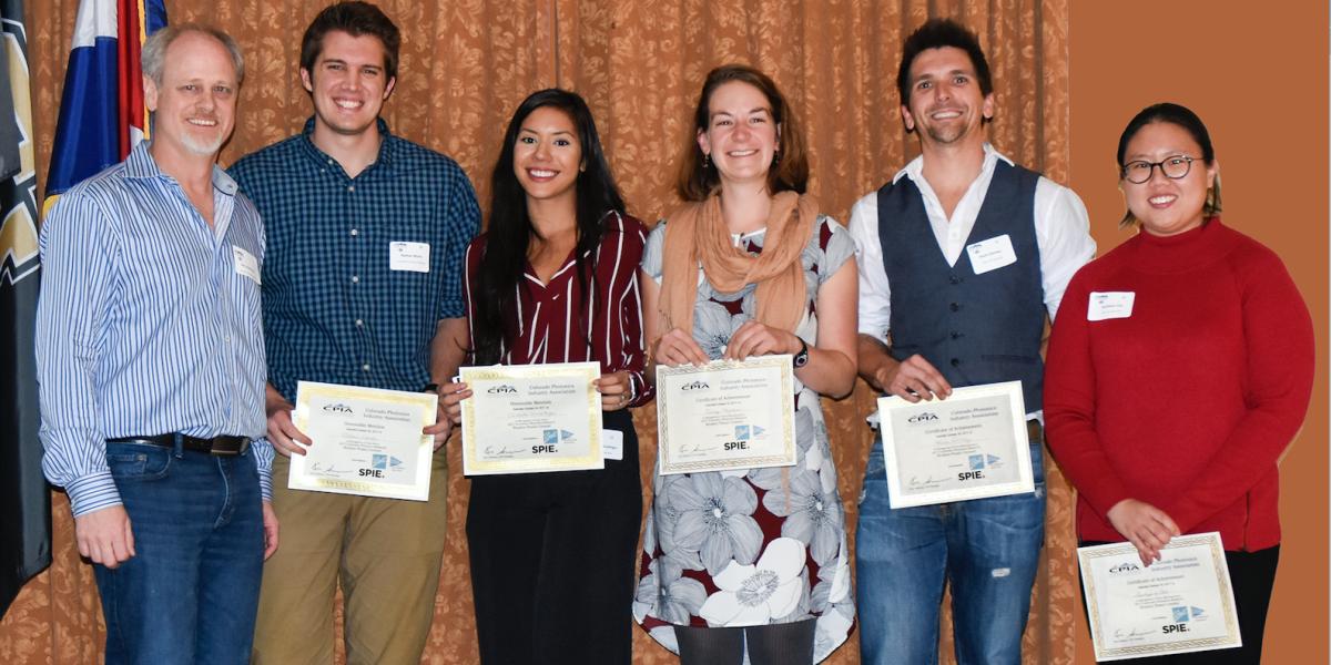 Greg Rieker's group with certificates after their posters