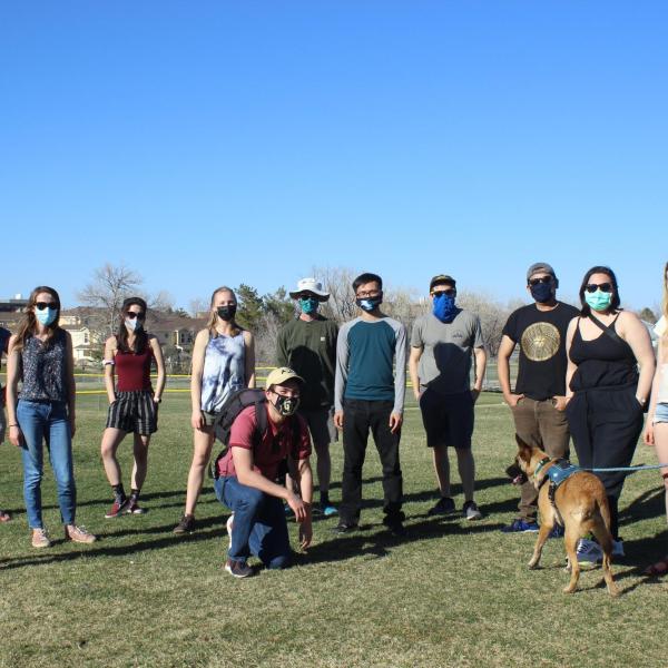 Lab members in green field