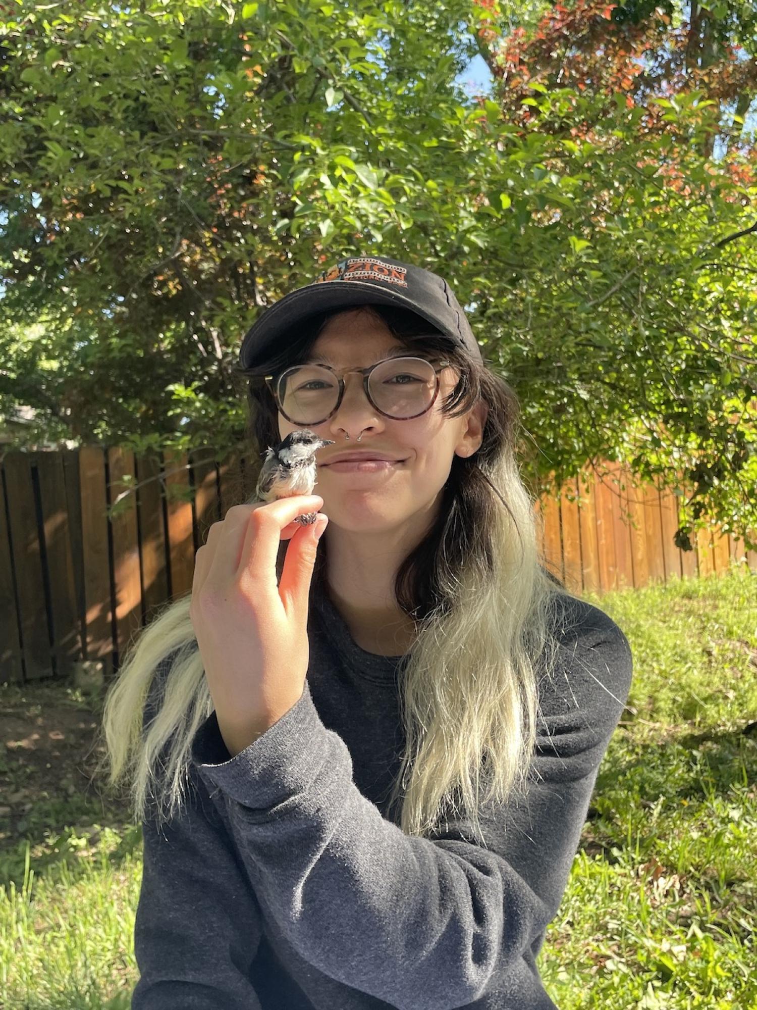 Olivia with a chickadee