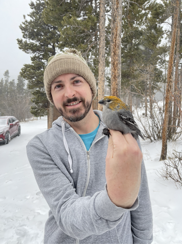 Scott with a female pine grosbeak