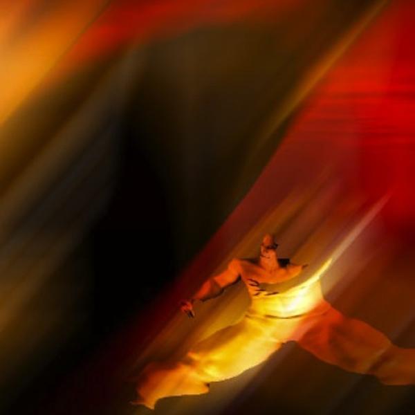 human figure glitched to the bottom right corner in a sea of red and black color blends