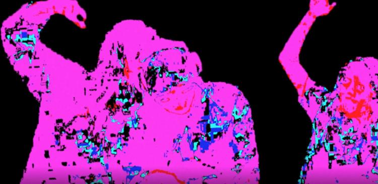 A pink silhouette of people dancing on a black background.