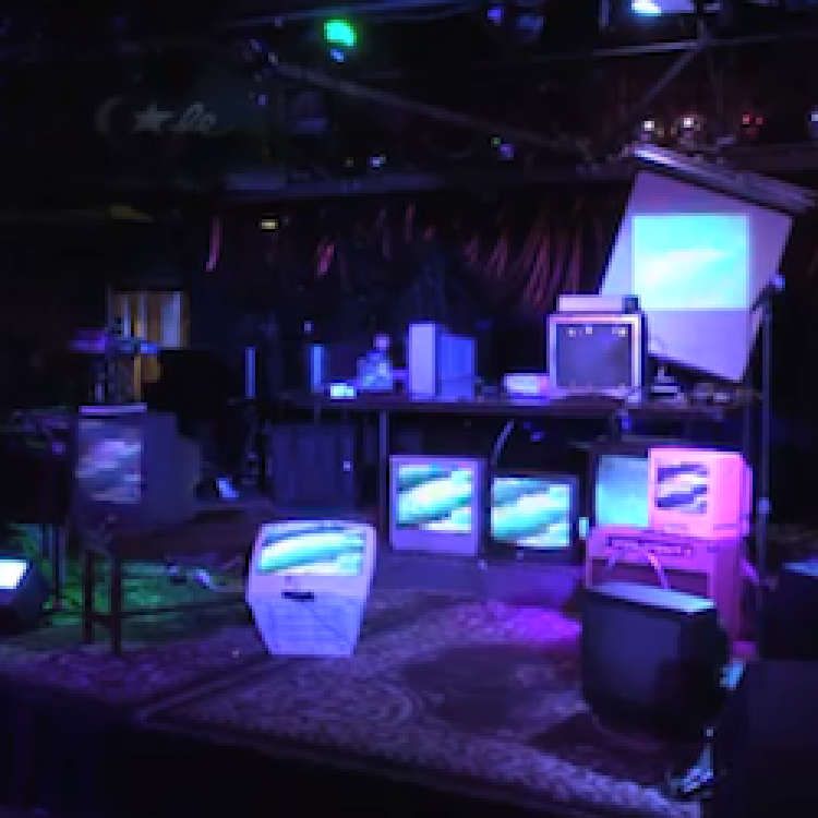 art installation with many screens showing glitched images