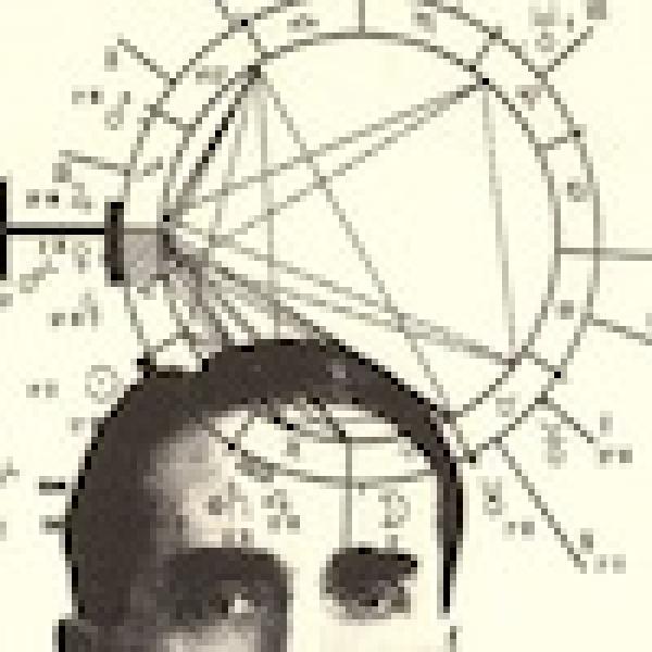 image of the top of a mans head with geometry floating around