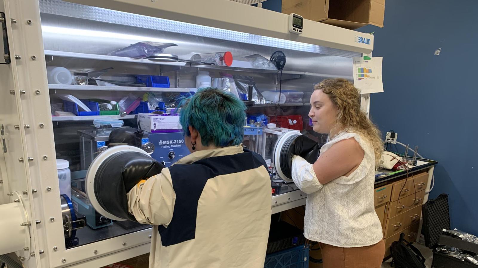 Kelsey showing local high school students the glovebox.
