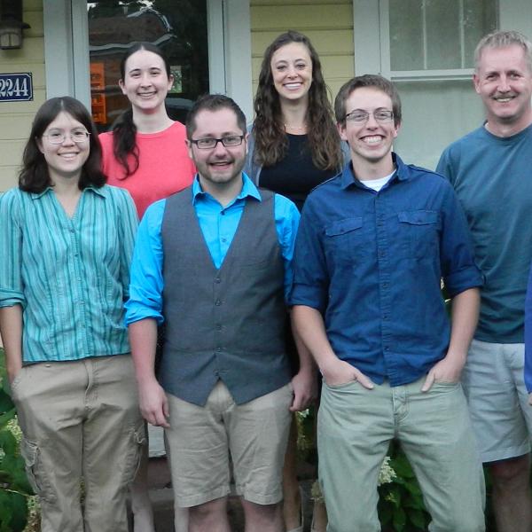 Vaida group standing outside a house