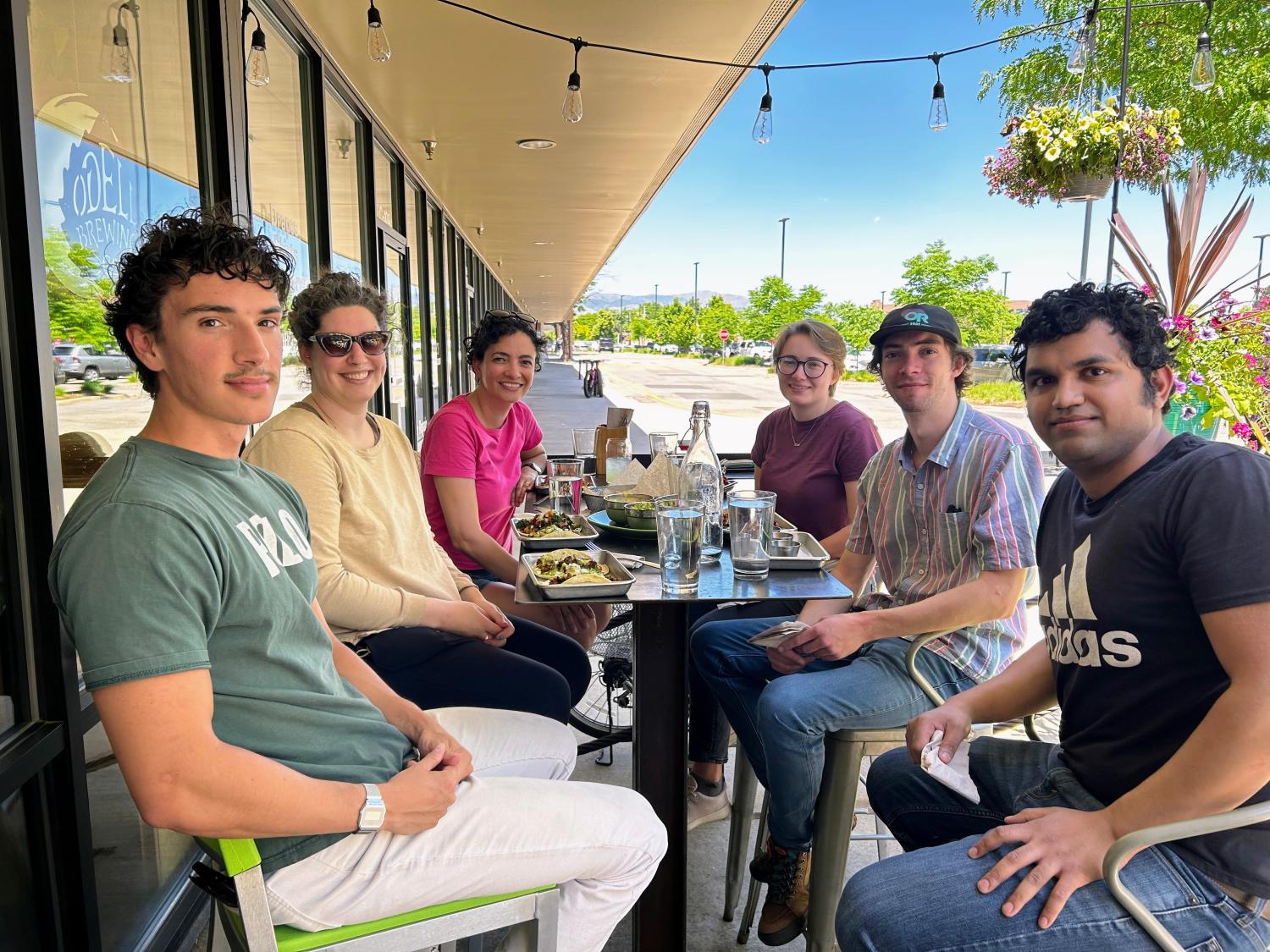 Vance Group sitting around an outdoor restaurant table