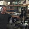 Chris Bartel next to the 3D ceramics printer.
