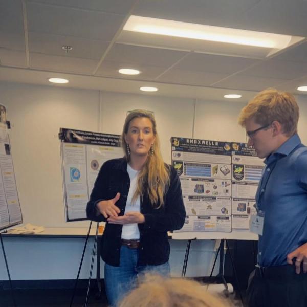 Georgianna Weihe presenting "A Comparison Study of Hardware and Software Security on IoT Devices" at the Rocky Mountain AIAA in Boulder, CO. September 28th, 2022.