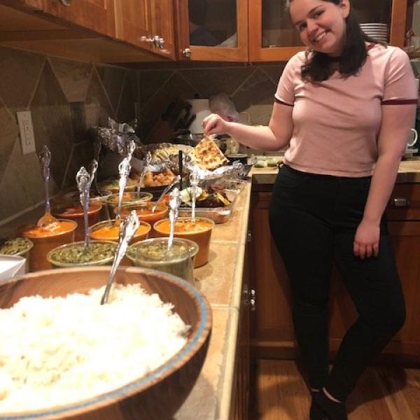 Aly poses with the copious amount of Indian food