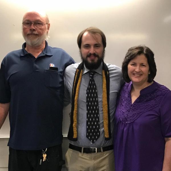 Neil poses with his proud parents