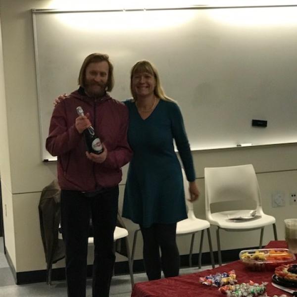 Nick and Debbie pose with bubbly