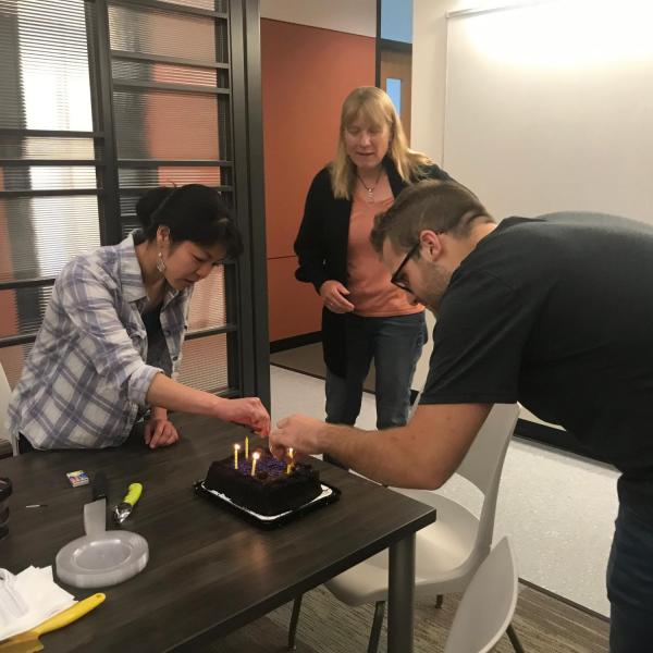 Meagan and Tom light the candles