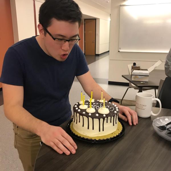 Nick blows out the birthday candles