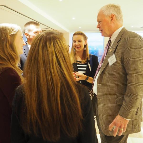 Students speaking with Judge Buchanan at 2016 reception