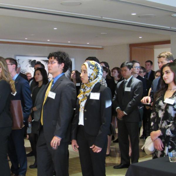 Students listening to remarks at 2018 reception