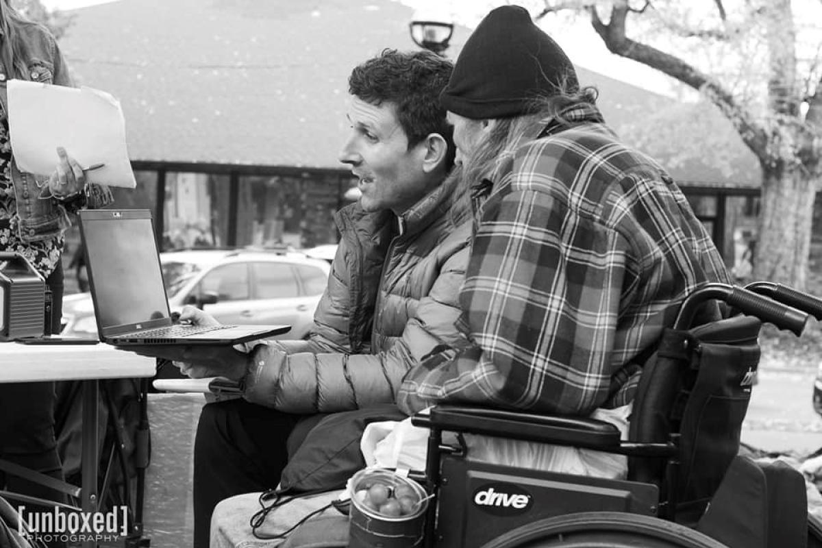 Chris Reynolds works with an unhoused client
