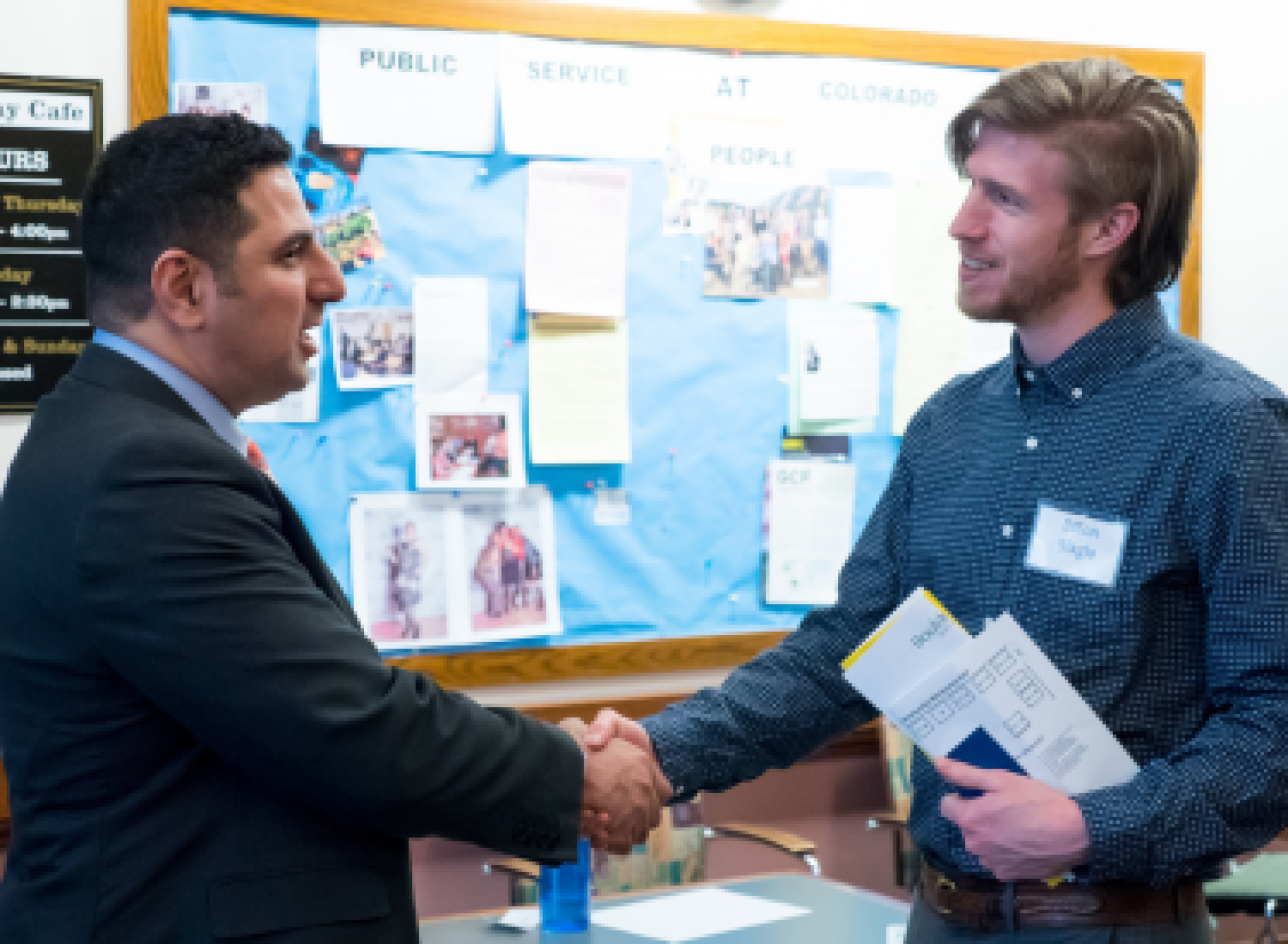A student and employer shaking hands