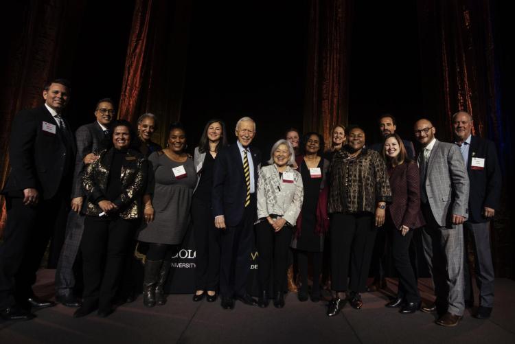 The Law Alumni Board on stage with the Dean and Georgette Vigil