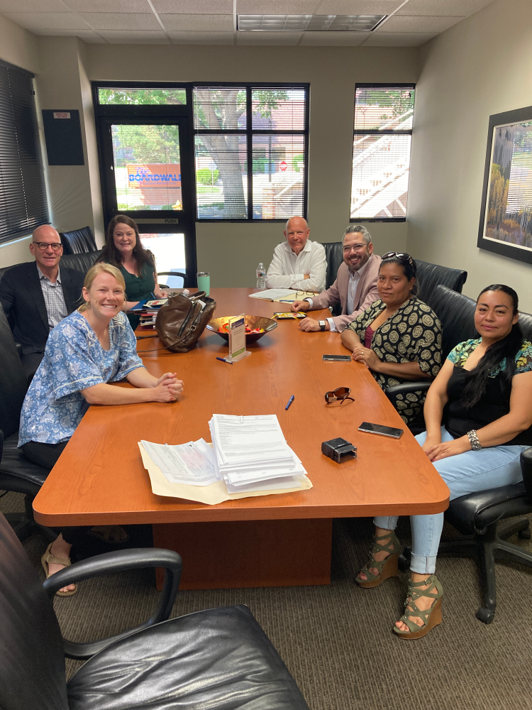 Members of UN/VU pictured with realtors at the closing on the purchase of the park.