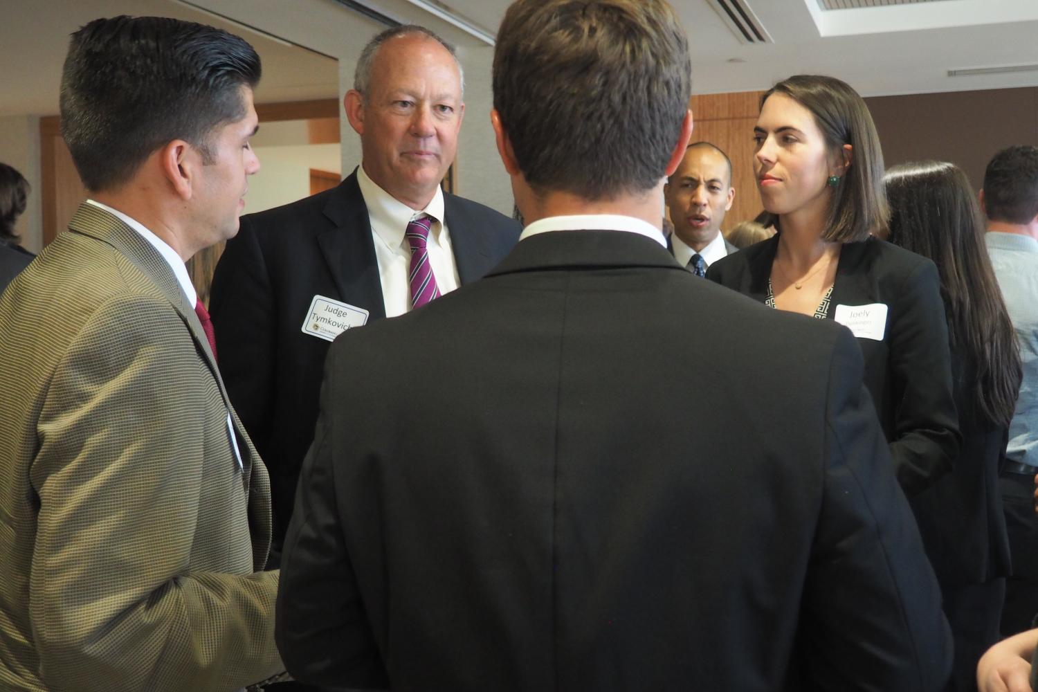 Judge Tymkovich chatting with students